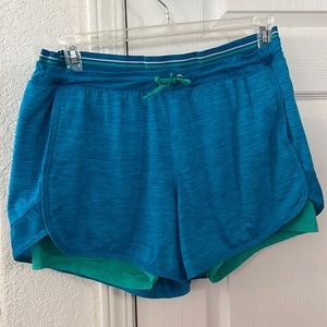 AVIA athletic shorts, size XL, turquoise shorts with green spandex.